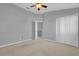 Spacious bedroom with double doors and carpet at 543 Rainbow Springs Loop, Groveland, FL 34736