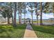 Private walkway to a lakefront gazebo and dock at 648 Banning Beach Rd, Tavares, FL 32778