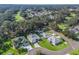 Aerial view of a neighborhood with houses and green spaces at 1454 San Clemente Ct, The Villages, FL 32159