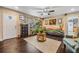 Living room with dark hardwood floors and eclectic decor at 402 Sunset Dr, Sanford, FL 32773