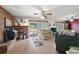 Spacious living room featuring a brick fireplace, tile floors, and ample natural light at 5011 Griffin View Dr, Lady Lake, FL 32159