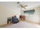 Bedroom with window, ceiling fan, and neutral carpeting at 5011 Griffin View Dr, Lady Lake, FL 32159