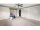 Large bedroom with ample closet space and neutral carpeting at 5011 Griffin View Dr, Lady Lake, FL 32159