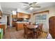 Kitchen with wood cabinets, tile flooring, and a dining area at 5011 Griffin View Dr, Lady Lake, FL 32159
