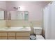 Clean bathroom with double sinks, toilet, and a shower at 5011 Griffin View Dr, Lady Lake, FL 32159