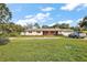 Front view of a ranch-style home with a brick facade and a two-car garage at 5011 Griffin View Dr, Lady Lake, FL 32159