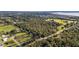 Aerial view of property with a large lot and nearby farmlands at 5011 Griffin View Dr, Lady Lake, FL 32159