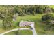 Aerial view of a ranch-style home with a large yard and detached building at 5011 Griffin View Dr, Lady Lake, FL 32159