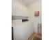 Clean laundry room with washer, dryer, and overhead cabinets at 4809 Saint Andrews Arc, Leesburg, FL 34748