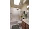 Clean bathroom with a bathtub, toilet, and vanity with double sinks at 4809 Saint Andrews Arc, Leesburg, FL 34748