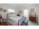 Charming bedroom featuring an antique-style bed frame and decorative accents at 4809 Saint Andrews Arc, Leesburg, FL 34748