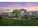 Single story home with landscaped yard and screened porch at 4809 Saint Andrews Arc, Leesburg, FL 34748