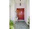 Inviting entryway with red door and tiled floor at 4809 Saint Andrews Arc, Leesburg, FL 34748