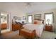 Main bedroom with double sinks and access to bathroom at 4809 Saint Andrews Arc, Leesburg, FL 34748