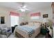 Bright bedroom with a comfortable bed and plenty of natural light at 4809 Saint Andrews Arc, Leesburg, FL 34748