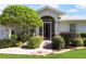 Well-maintained home with landscaped front yard and inviting entryway at 4809 Saint Andrews Arc, Leesburg, FL 34748