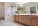 Bathroom with double vanity and separate shower at 4809 Saint Andrews Arc, Leesburg, FL 34748