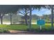 Lakeside gazebo with parking sign at 4809 Saint Andrews Arc, Leesburg, FL 34748