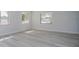 Spacious bedroom with hardwood floors and large windows at 6607 Kreidt Dr, Orlando, FL 32818