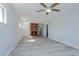 Living room featuring a brick fireplace and light grey laminate flooring at 6607 Kreidt Dr, Orlando, FL 32818