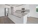 Modern kitchen with stainless steel appliances and a large island at 1180 Dora Parc Ln, Mount Dora, FL 32757