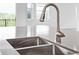 Kitchen features a modern double sink and faucet at 1180 Dora Parc Ln, Mount Dora, FL 32757