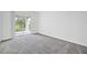 Bedroom with sliding door leading to a patio at 1180 Dora Parc Ln, Mount Dora, FL 32757