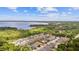 Community overview, showcasing lakefront homes and lush landscaping at 1180 Dora Parc Ln, Mount Dora, FL 32757