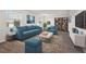 Spacious living room featuring a comfortable sofa and built-in shelving at 1180 Dora Parc Ln, Mount Dora, FL 32757