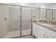 Large bathroom with a walk-in shower and single vanity at 1180 Dora Parc Ln, Mount Dora, FL 32757