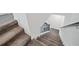 Modern staircase with metal railing and carpet at 1180 Dora Parc Ln, Mount Dora, FL 32757