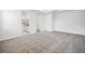 Bright and spacious primary bedroom with carpeting and ensuite bath at 1180 Dora Parc Ln, Mount Dora, FL 32757