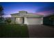 New construction home with a two car garage and driveway at 1180 Dora Parc Ln, Mount Dora, FL 32757