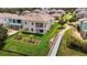 Aerial view of a house with landscaped yard near a boardwalk at 1180 Dora Parc Ln, Mount Dora, FL 32757