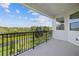 Spacious balcony with picturesque lake and nature views at 1180 Dora Parc Ln, Mount Dora, FL 32757