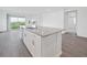 Open concept kitchen with large island and breakfast bar at 1180 Dora Parc Ln, Mount Dora, FL 32757