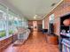 Bright and airy sunroom with tiled floors and plenty of natural light at 1559 Lakeshore Dr, Eustis, FL 32726