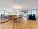 Bright dining room with hardwood floors and views to kitchen and Gathering room at 1559 Lakeshore Dr, Eustis, FL 32726
