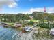 Aerial view of waterfront home with private dock and boat slips at 1559 Lakeshore Dr, Eustis, FL 32726