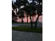 Scenic sunset view over lake from the property at 1559 Lakeshore Dr, Eustis, FL 32726
