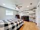 Bedroom with hardwood floors and a ceiling fan at 1559 Lakeshore Dr, Eustis, FL 32726