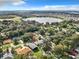 Aerial view showing the home's location near the lake at 1559 Lakeshore Dr, Eustis, FL 32726