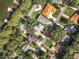 Aerial view of home and neighborhood near lakefront at 1559 Lakeshore Dr, Eustis, FL 32726