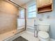 Bathroom with shower stall, toilet and single vanity at 1559 Lakeshore Dr, Eustis, FL 32726