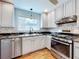 Updated kitchen with stainless steel appliances and granite countertops at 1559 Lakeshore Dr, Eustis, FL 32726