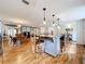 Open kitchen with island and breakfast bar, hardwood floors, and views to Gathering room at 1559 Lakeshore Dr, Eustis, FL 32726