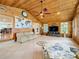 Relaxing sunroom with wood ceiling, tile floors, and water views at 1559 Lakeshore Dr, Eustis, FL 32726