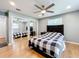 Bedroom with hardwood floors and a ceiling fan at 1559 Lakeshore Dr, Eustis, FL 32726