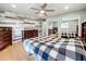 Bedroom with hardwood floors and a ceiling fan at 1559 Lakeshore Dr, Eustis, FL 32726