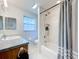 Bathroom with tub, shower, and vanity at 1559 Lakeshore Dr, Eustis, FL 32726